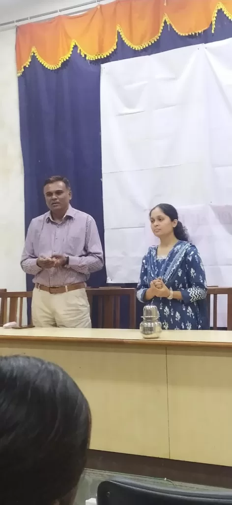 Dr. Ajay Hanmane presenting on the role of Homoeopathy in Female Health Problems at Mahaveer College Ladies Hostel orientation in 2022.